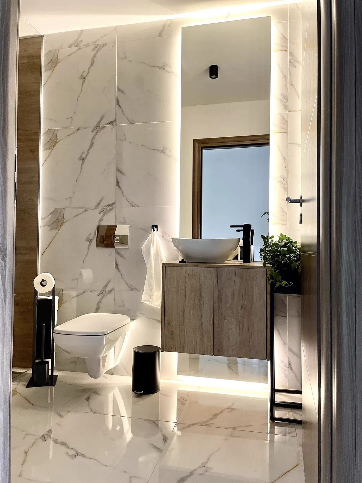 Modern bathroom with elegant tiling and ambient lighting