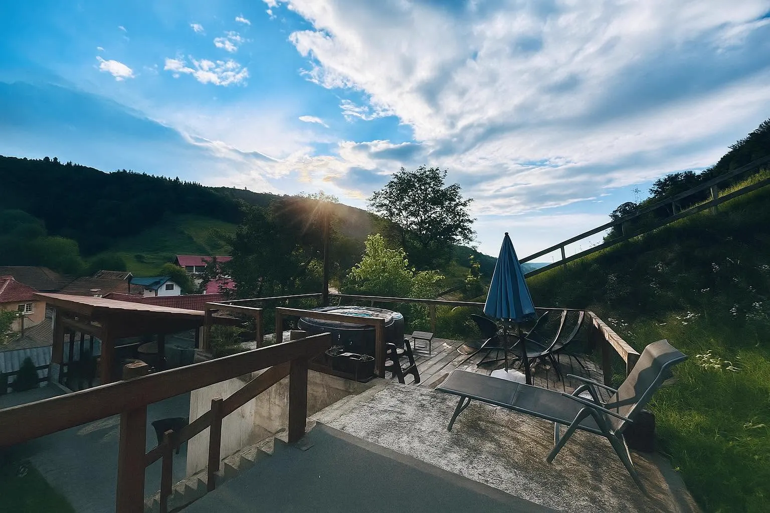 Terrace with hot tub and sunset view