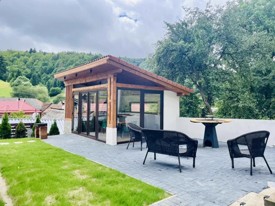 Outdoor gazebo with terrace and rattan chairs