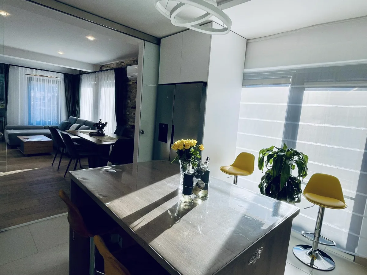 Kitchen with island and yellow bar stools